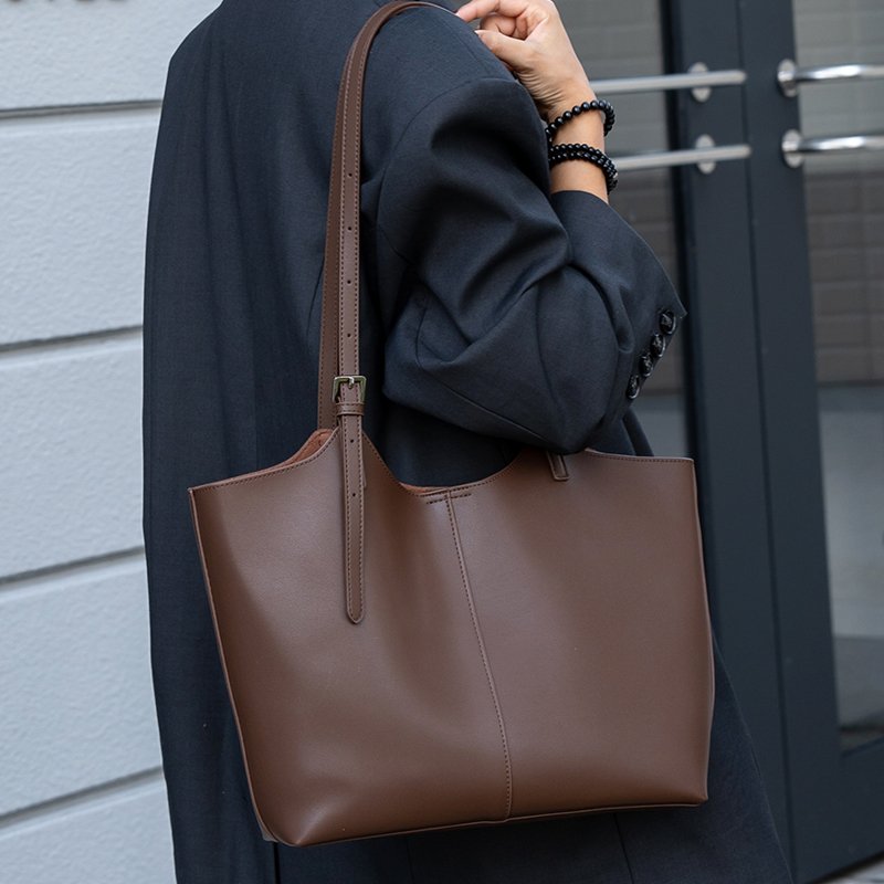 woman carrying a leather bag in a lifestyle photo