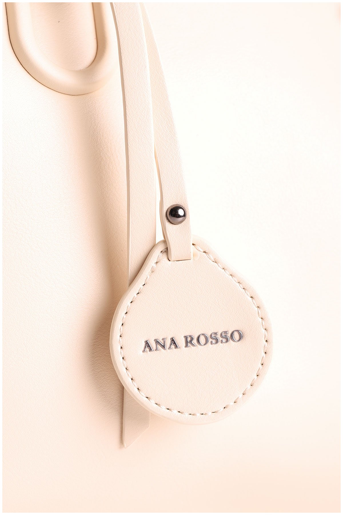 details on a beige woman handbag