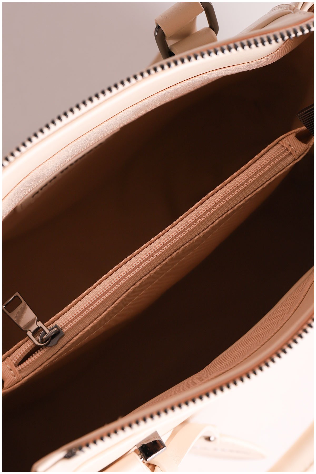 inside of a beige woman handbag