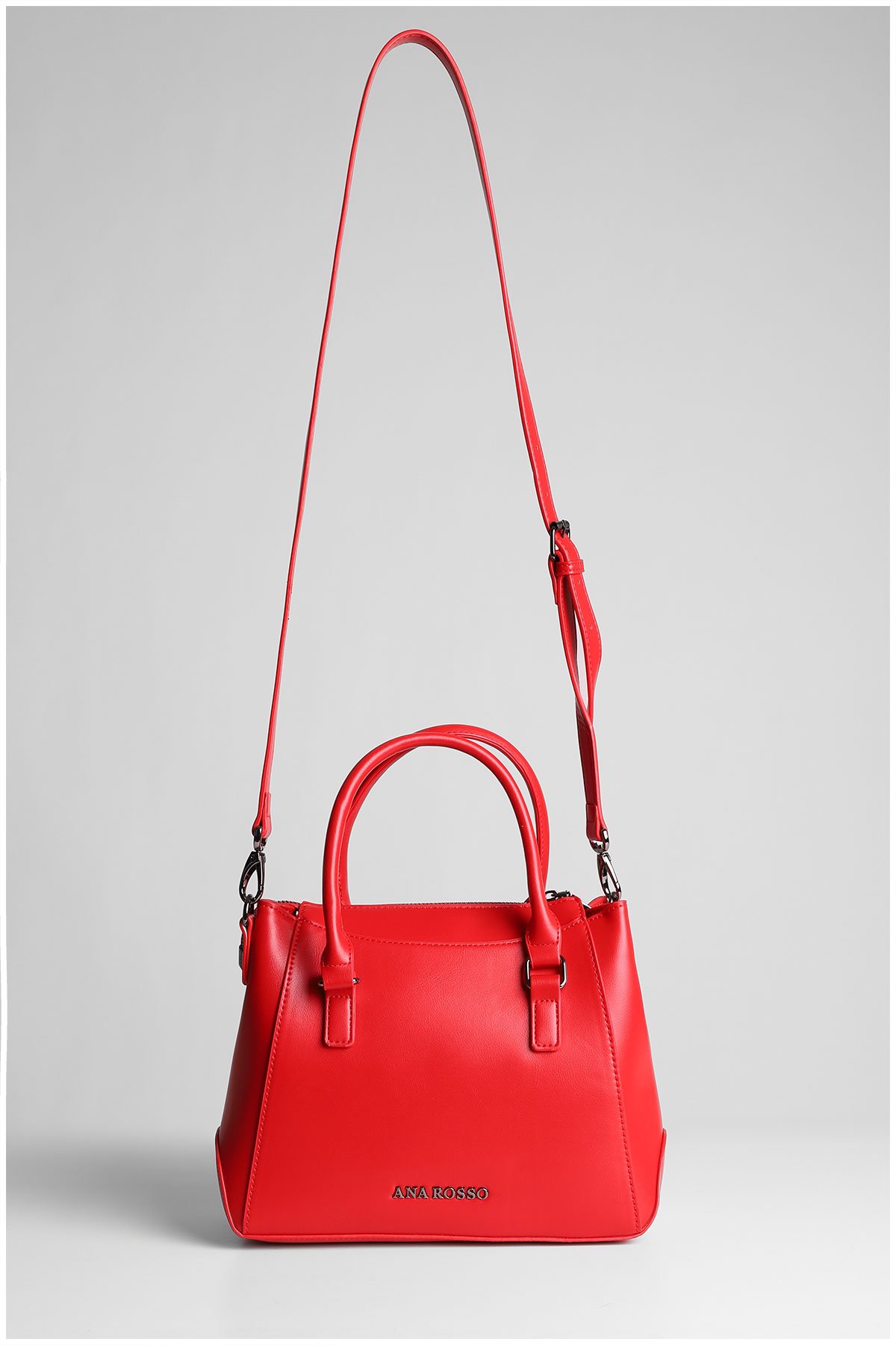 red woman handbag with a strap