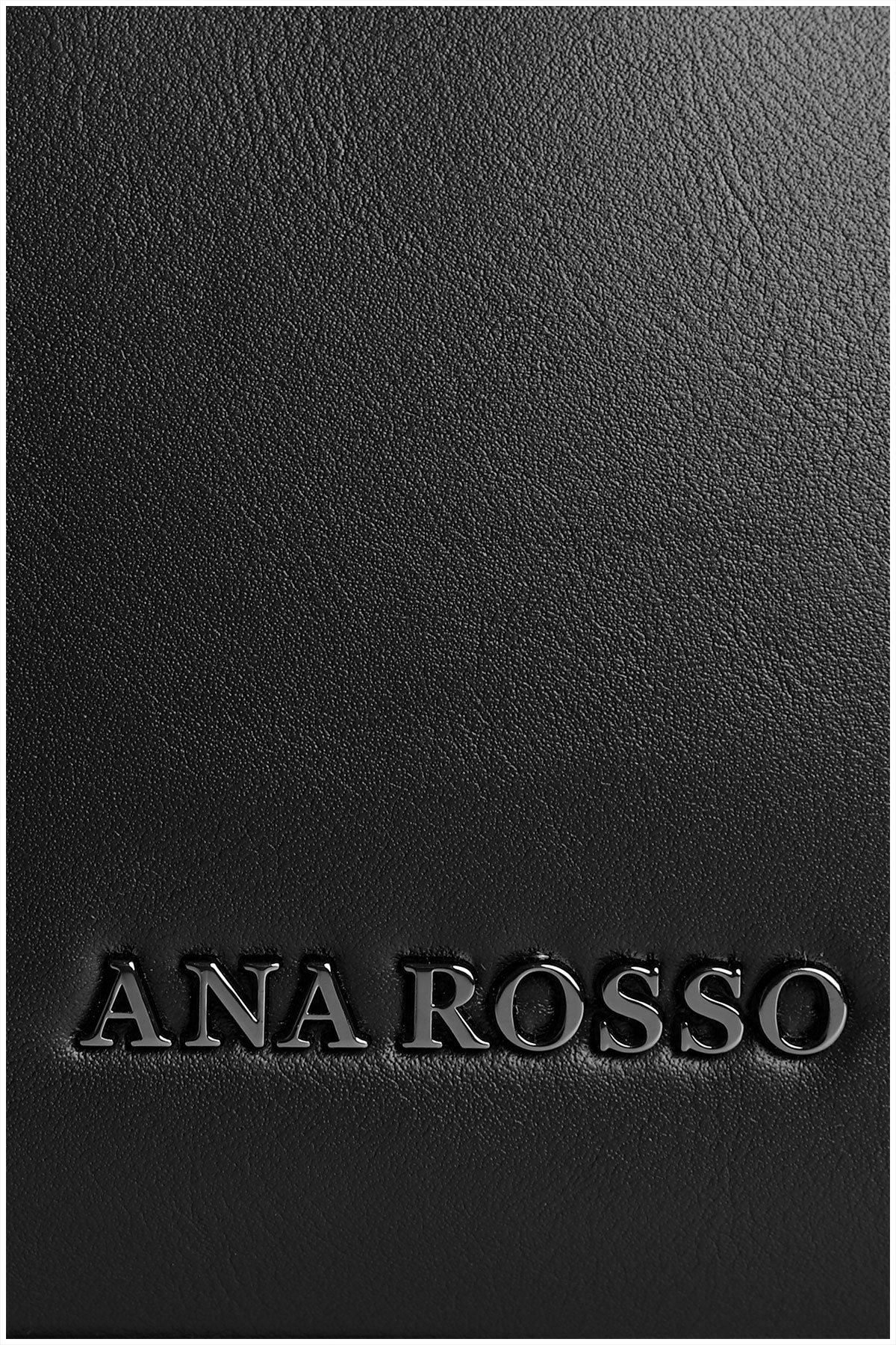 metal details on a black woman handbag