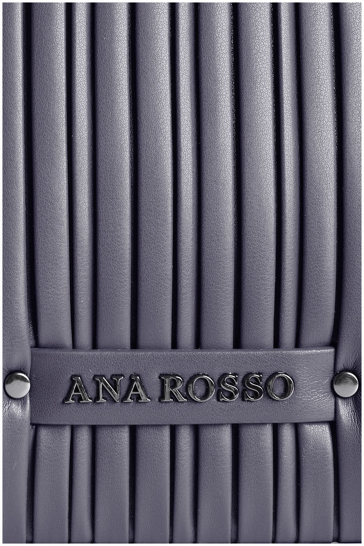 metal details on a navy blue woman handbag